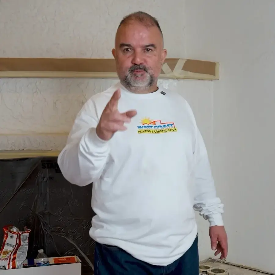 A West Coast Painting team member on a job
